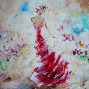 A woman in a red gown finds wild flowers blooming in the desert.